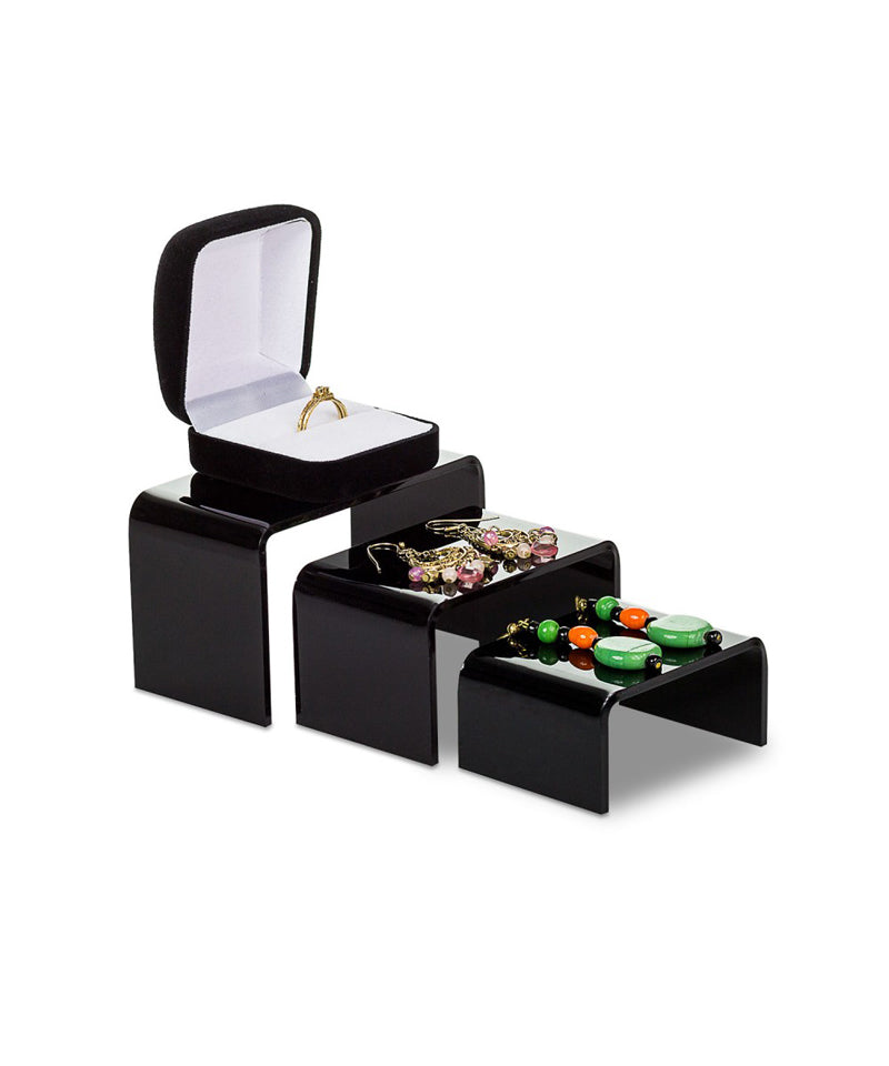 black jewelry and product riser